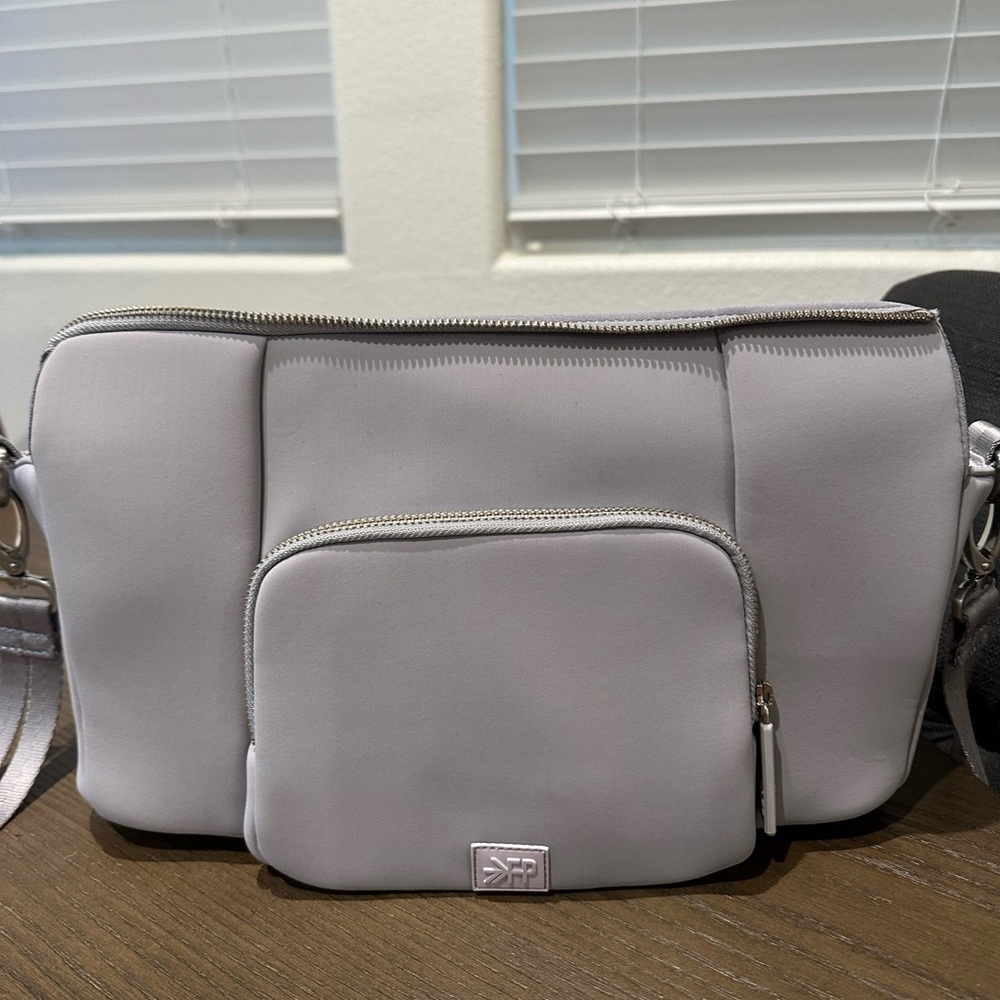 Stroller caddy light grey. Small stain on bottom as shown in pictures.